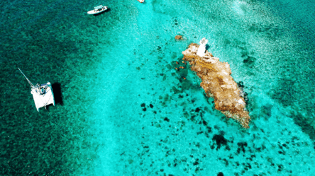 Aerial shot of El Farito Reef with catamarans
