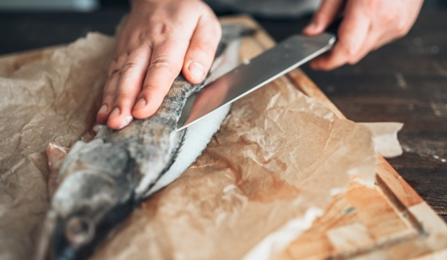 chef-hands-with-knife-cut-up-fish-on-cutting-board-2021-08-26-16-25-41-utc-1-1-1