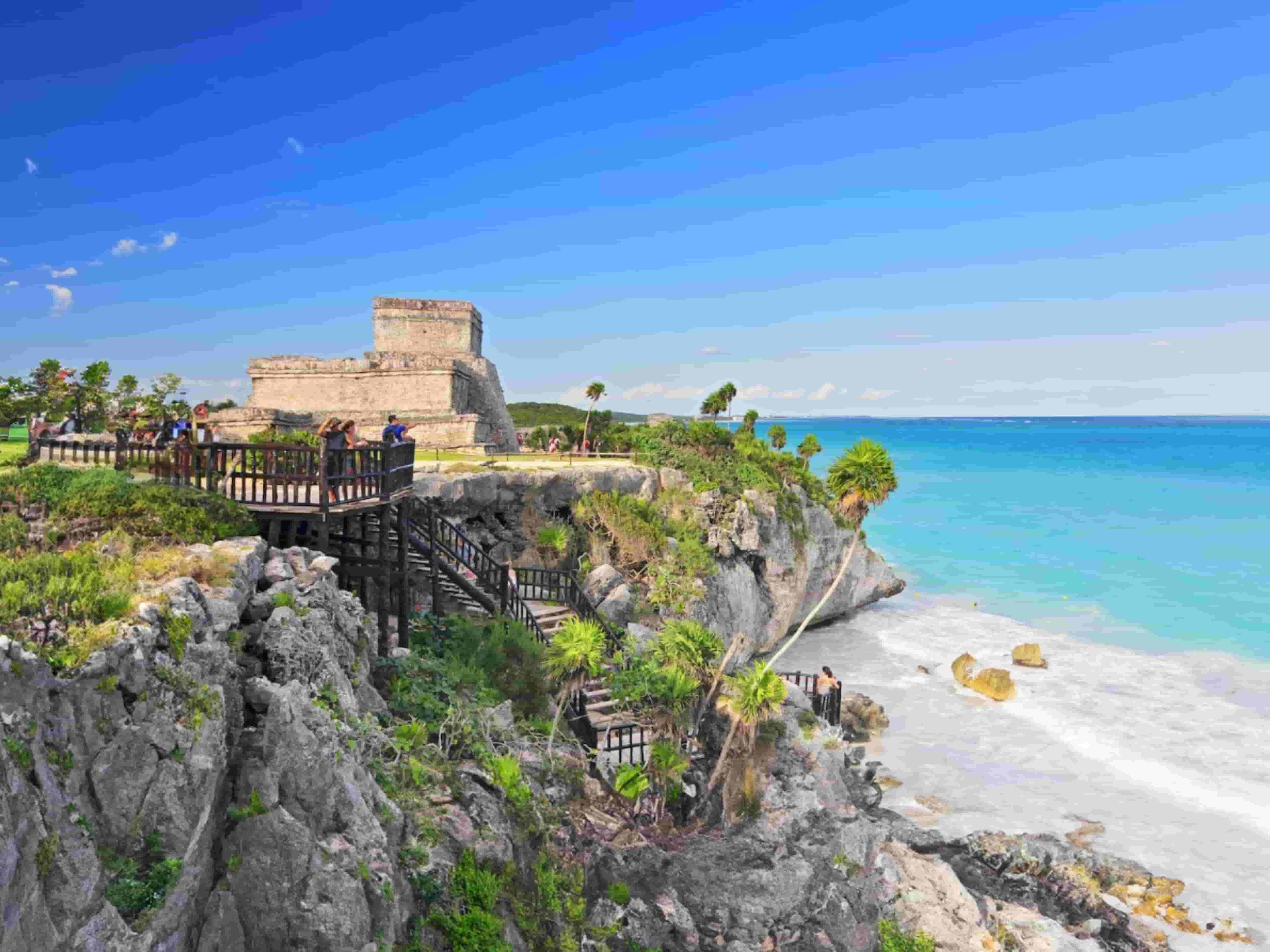 View of the castle and cliff in front of the sea in Tulum archaeological zone.